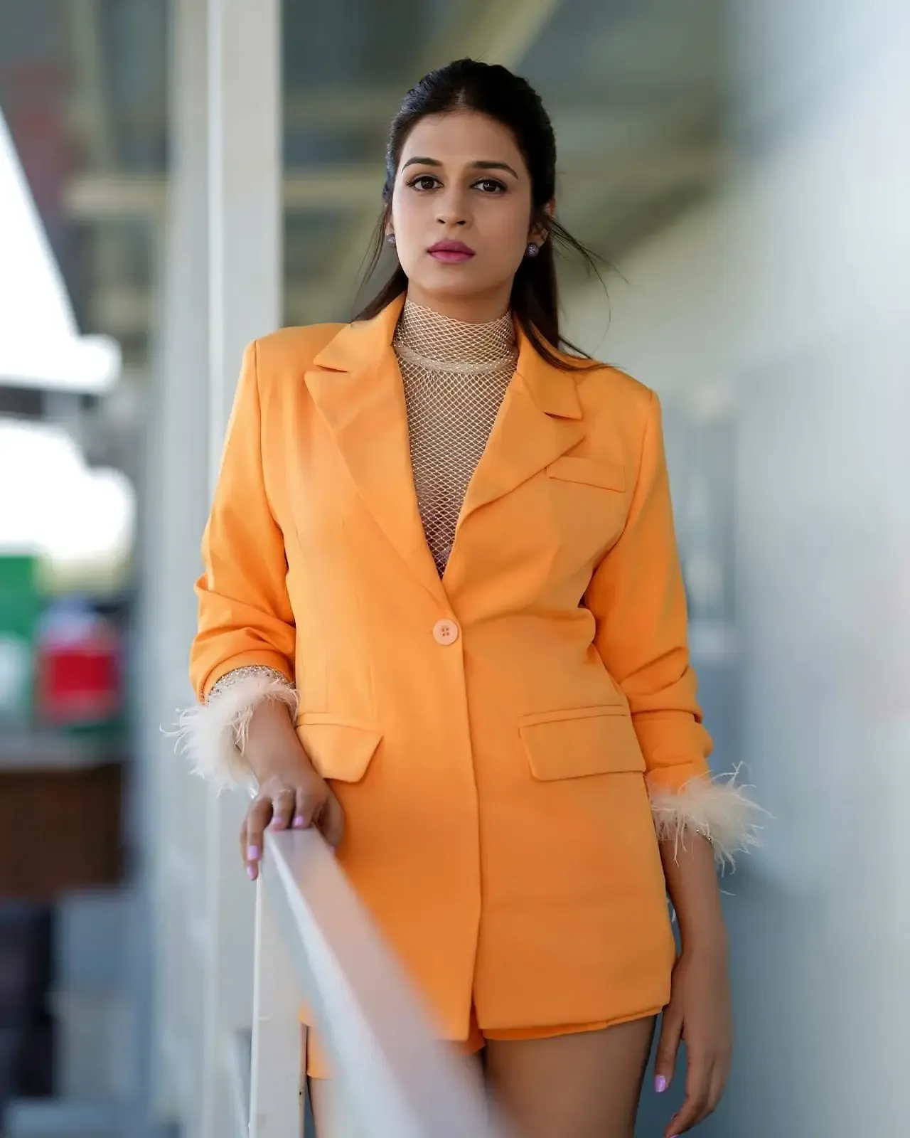 Actress Shraddha Das Long Legs Show in Mini Orange Top